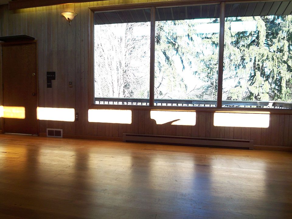 Wide plank hardwood lines the floors