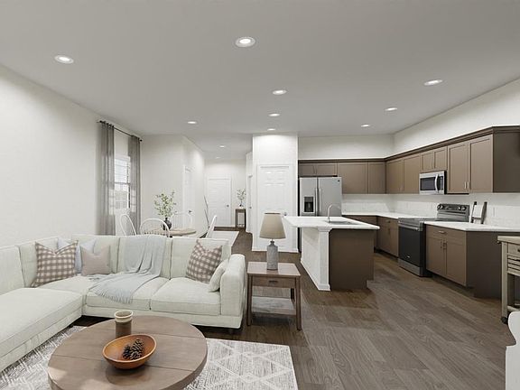 Your new home includes open-concept living space. Artists rendering of the Capri