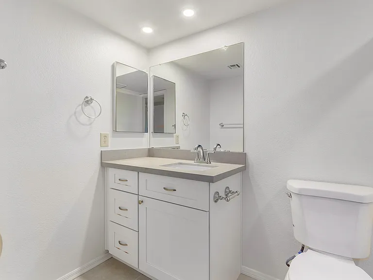 Remodeled Downstairs Bathroom. NEW fixtures, paint, lighting, cabinets.