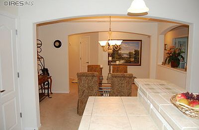 Sit at the counter in kitchen for coffeel