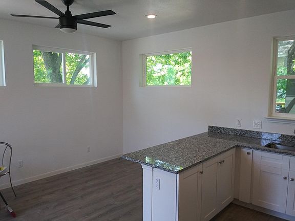 Living Area off Kitchen with shade from surrounding trees