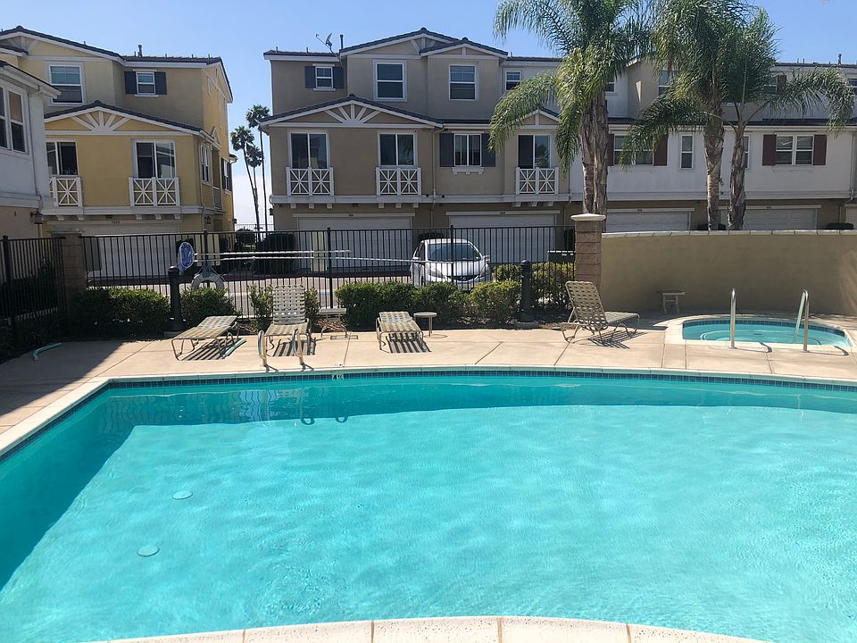 pool and hot tub. Condo is directly to the right of this picture.