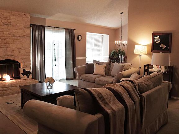 Open living room with vaulted ceilings and lots of natural l