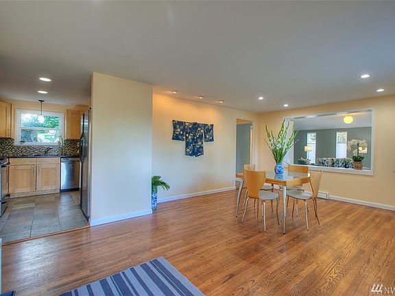 Beautiful hardwoods in dining room with pass through to living room