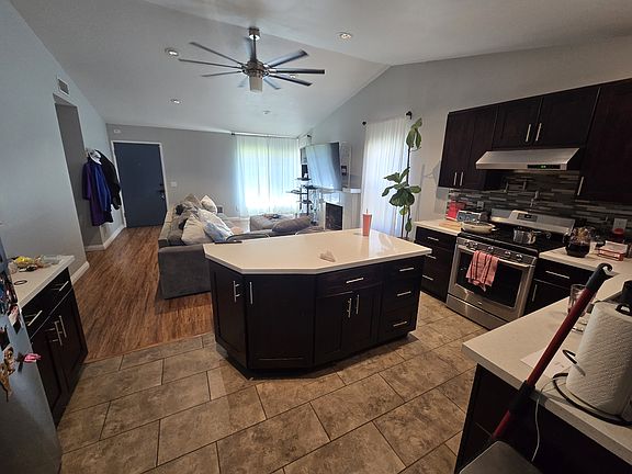 Open floor plan that has living room connected to kitchen