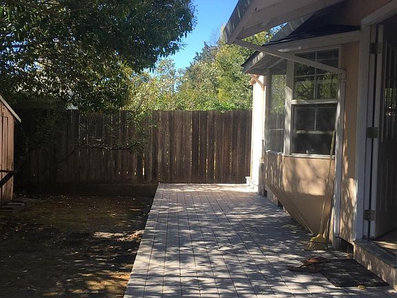 Deck and entry behind main house.