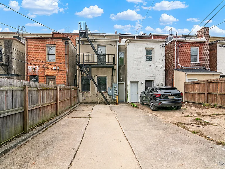 Private off-street parking pad with private access to apartment 1A.