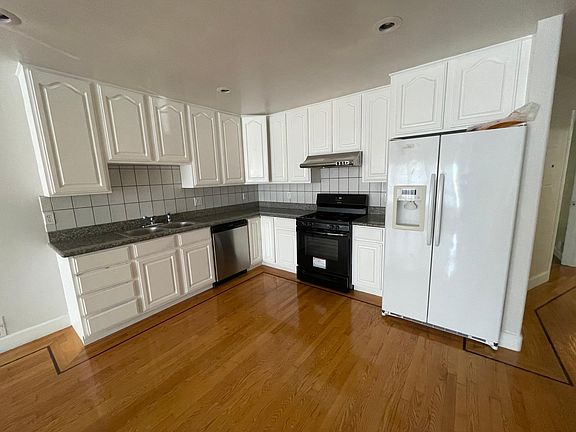 Kitchen Area: - Granite countertops - Extra large refrigerator - Wood floors - Dish Washer - Extra storage space