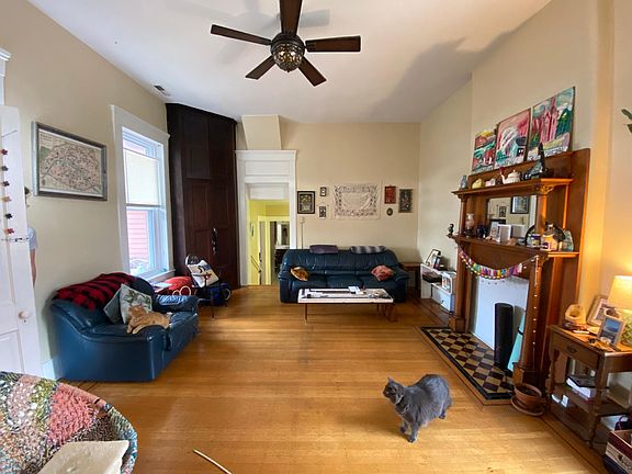 Living room looking toward dining room and bathroom. Door to left is the deck entry.