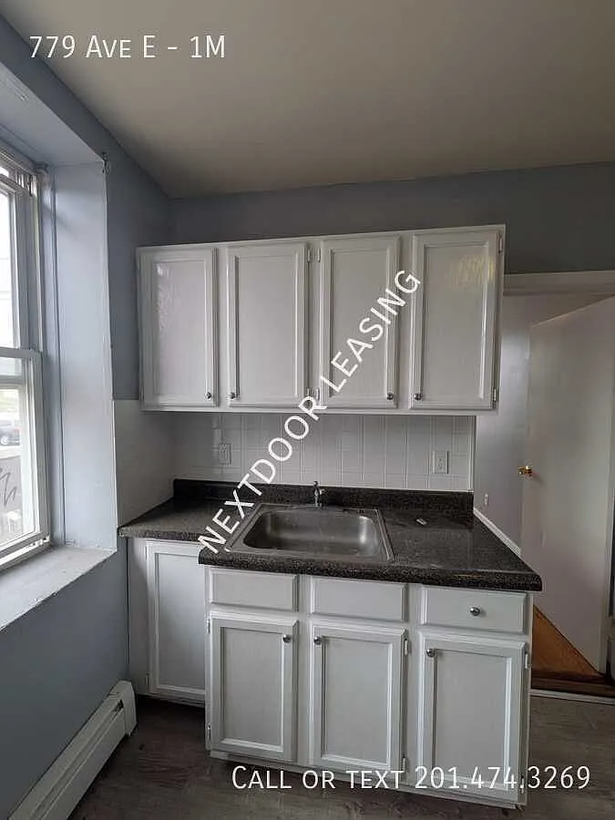 779 Ave E — Photo 1
