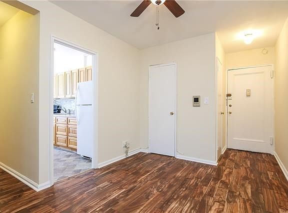 Soon after you enter you will be in the dining area, with ceiling fan, where you will see a glimpse of the kitchen, a linen clos