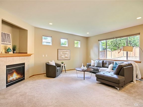 Spacious great room features a gas fireplace.