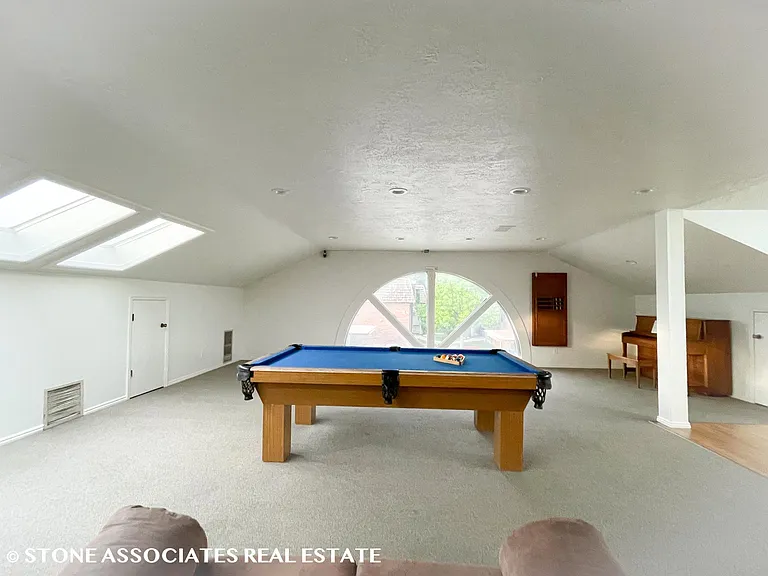 Community clubhouse with pool table and lounge space _ perfect for relaxing or gathering with friends.