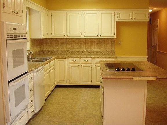 Kitchen has lots of Cabinets including corner "lazy susan" cabinet