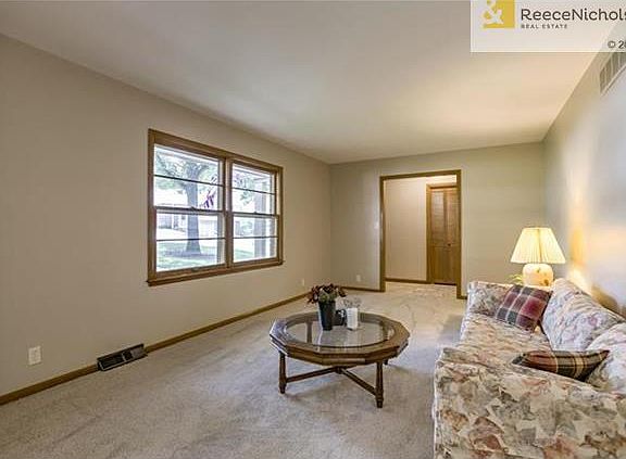 Living room,  new carpet & great light.