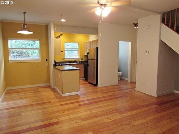 Living room, kitchen, with dining area.