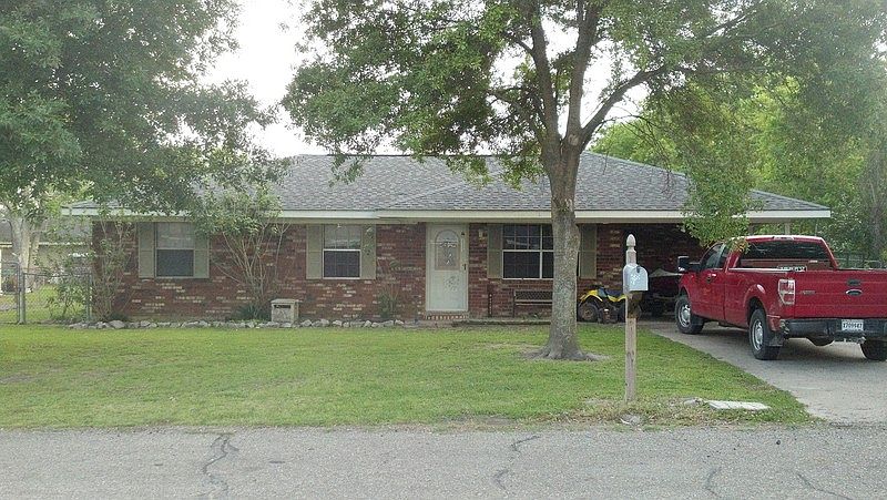 Front of Residence.
						:
						Two Oak Trees provide shade as well as aesthetic appeal.