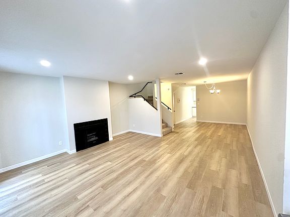 Living room with gas fireplace and sliders to patio