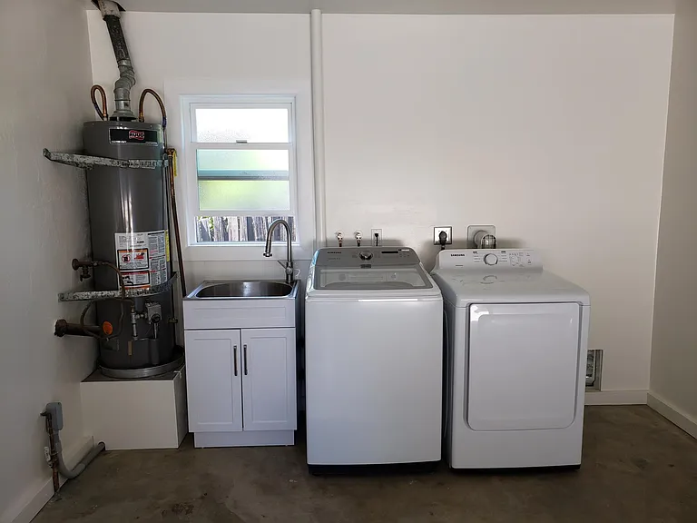 Washer and dryer in finished, 1 car garage.