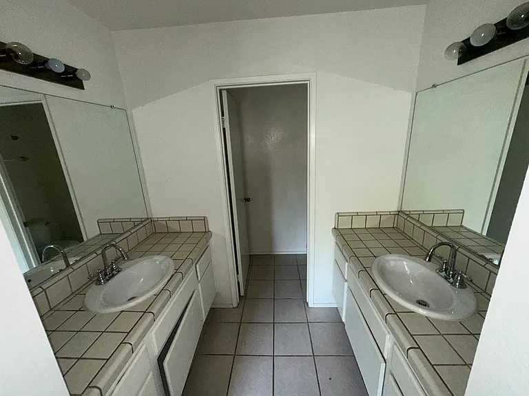 jack and jill sinks with bottom storage in main bathroom
