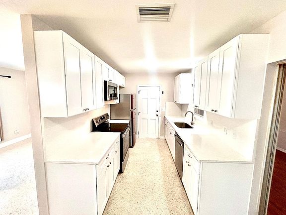 Brand new Kitchen cabinets, stainless single bowl sink, stainless stove, microwave & dishwasher.