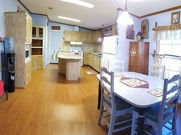 Upgraded kitchen with new granite counter-tops and flooring.