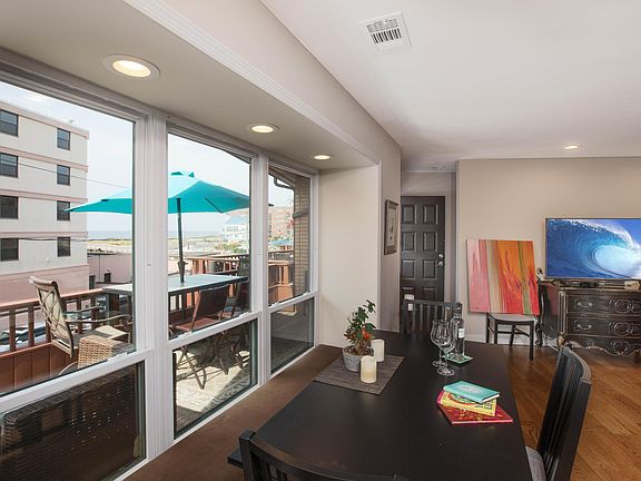 Dining area with view to private patio and ocean beyond