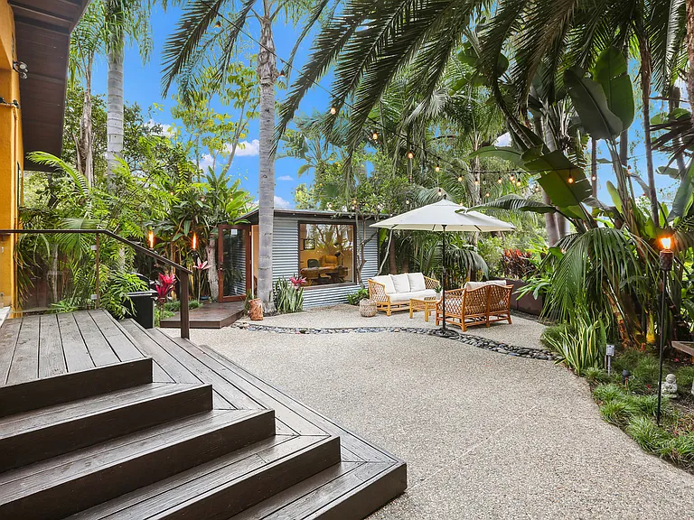 Steps from main portion of home leading to the backyard and detached Bedroom & Office