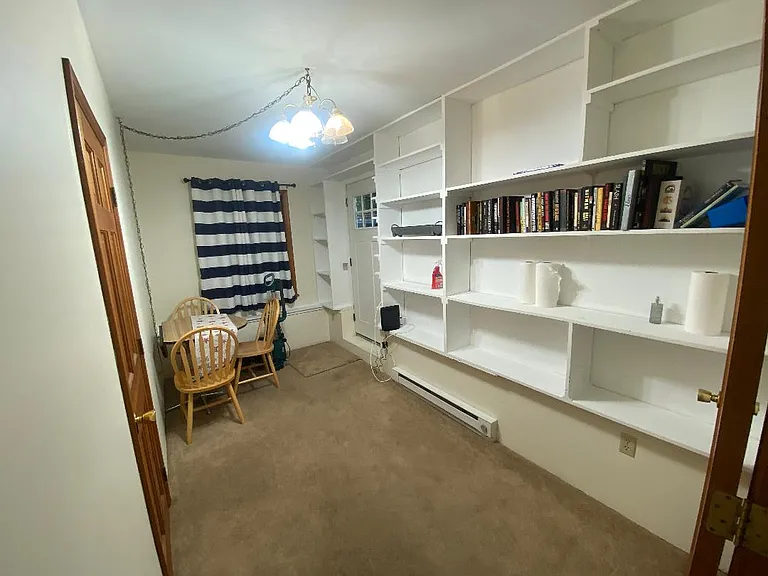 Extra bedroom/ or dining room/office.
Lots of bookshelves, storage shelves