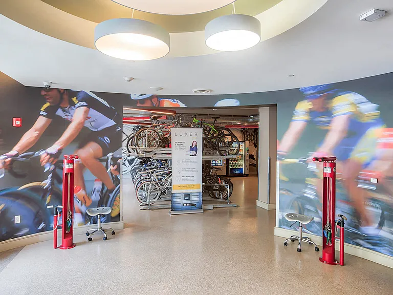 Bike lounge equipped with repair stations, seating and TVs