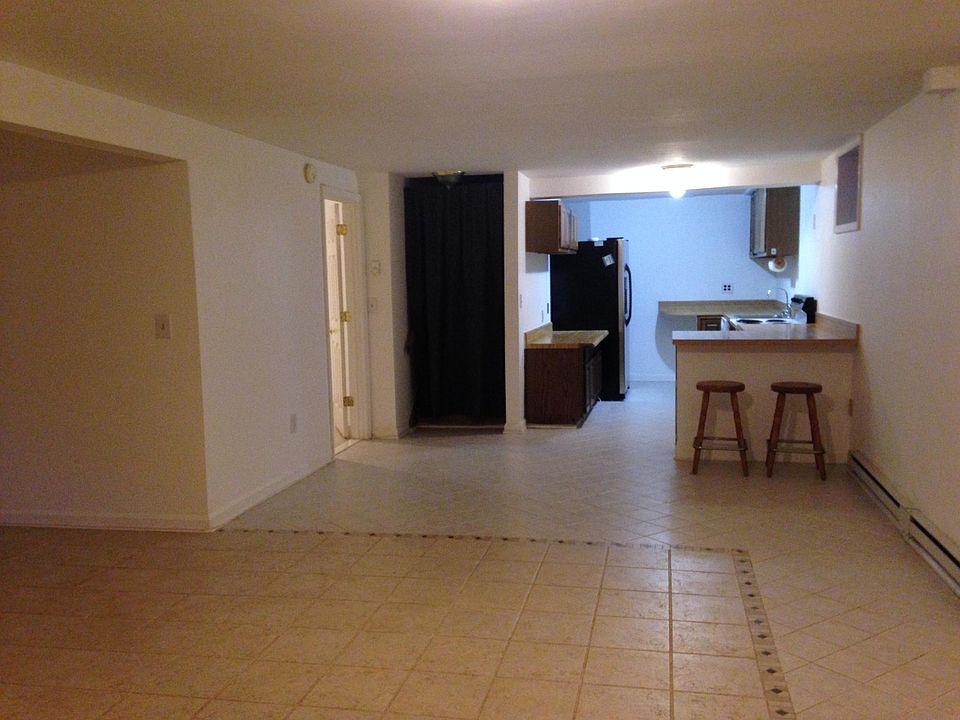 Living Room facing Dining Room and Kitchen. Note ornate tile floors.