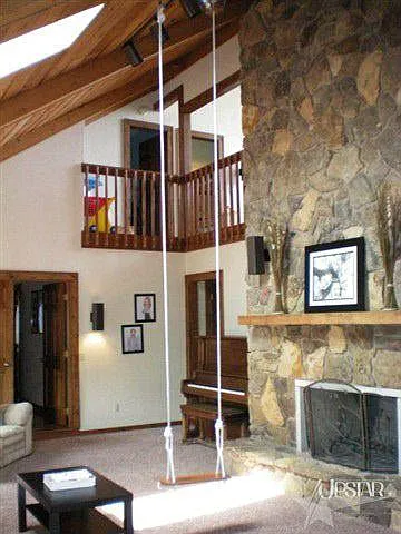 Two story stone fireplace adds warmth to to the whole home.