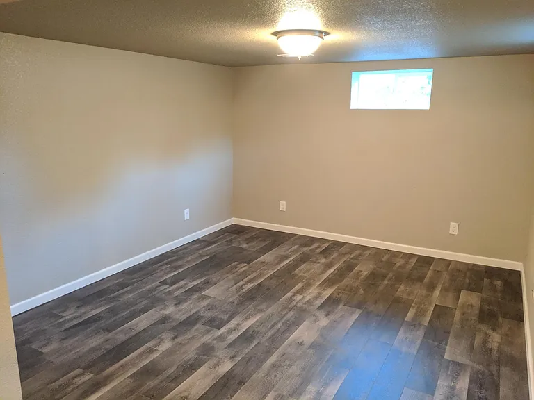 Living Room is 12.7x11.4 ft with plenty of room for an L shaped couch, chair, TV/Entertainment stand, etc.
