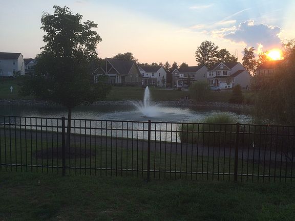View of the pond and walking path from the back yard BBQ