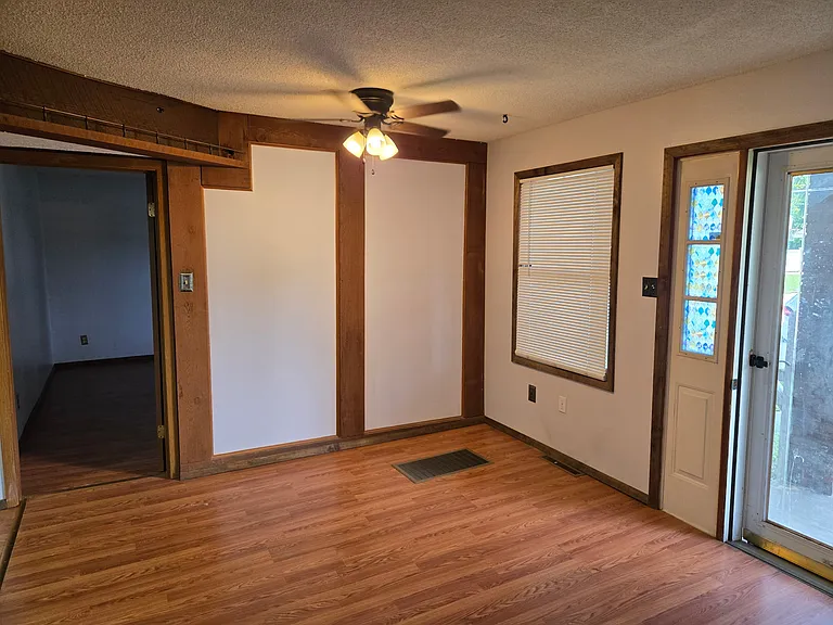 Dining Area. Front Door has full glass front storm door with keypad entry.