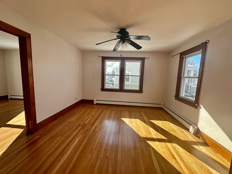 Living area with bedroom door on left