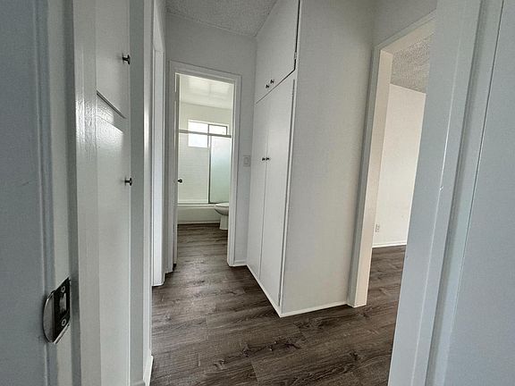 Hallway featuring ample storage