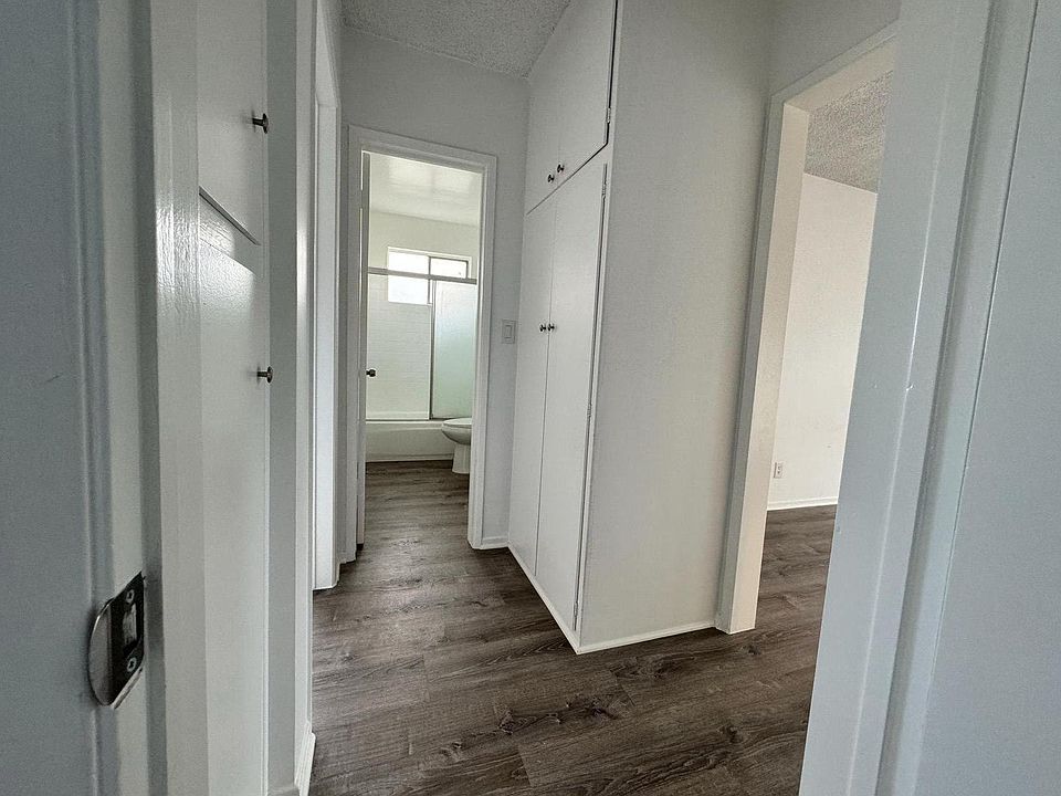 Hallway featuring ample storage