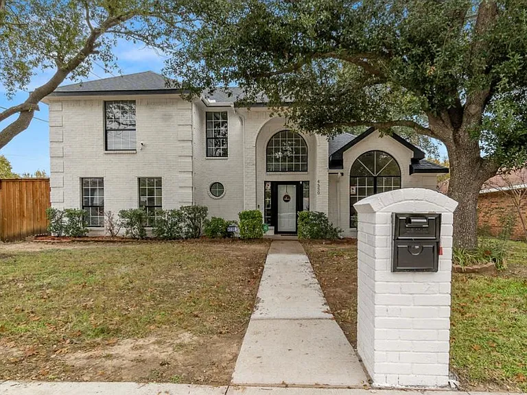 Front. Elegant white and black house.