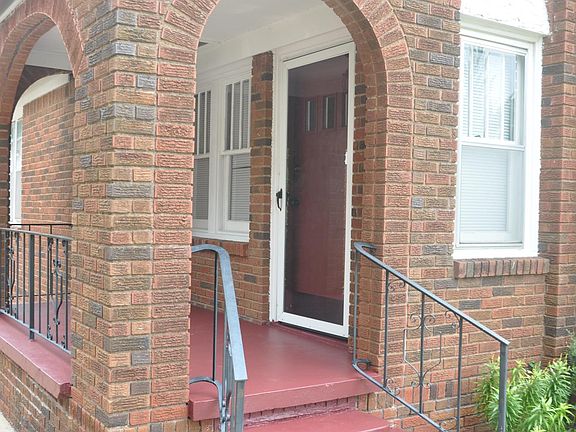 Front porch beckons a rocking chair, a glass or wine, and a good book.