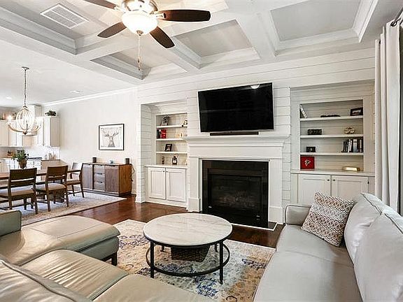 Living Room with built-in storage; gas fireplace.