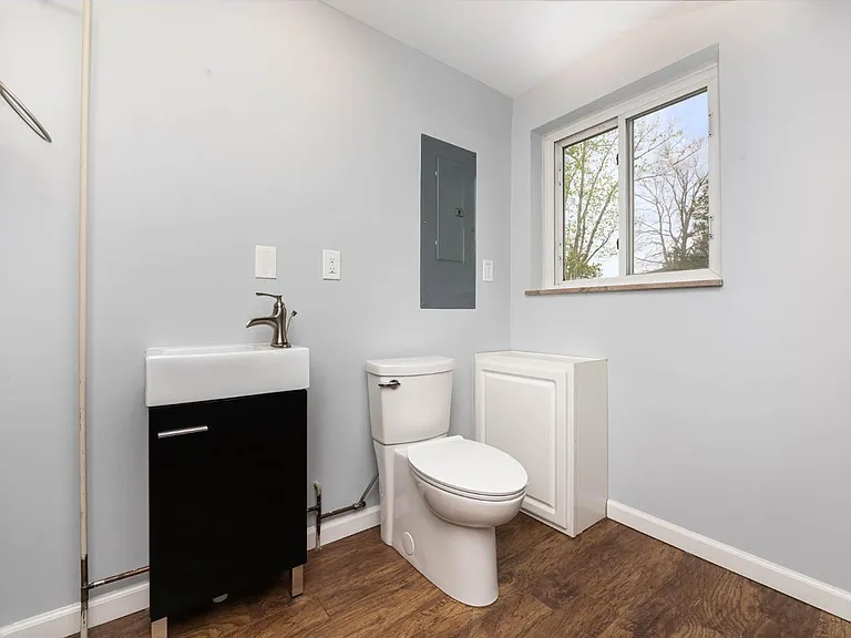 Mechanical Room/ Half Bath off mud room.