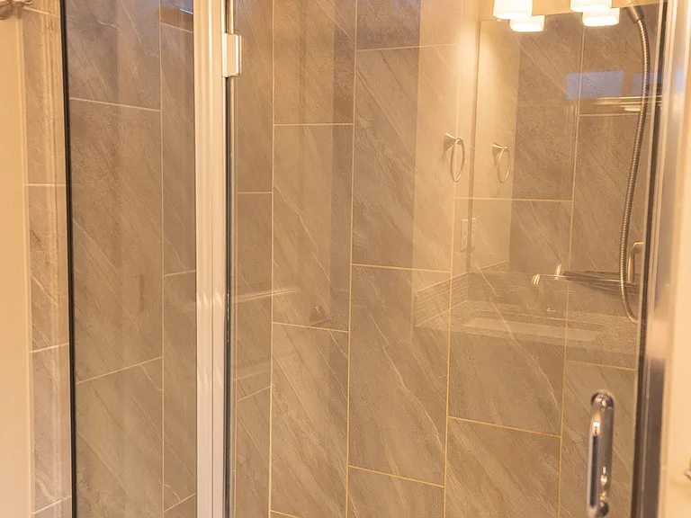 Master Shower - handheld shower head, tiled walls