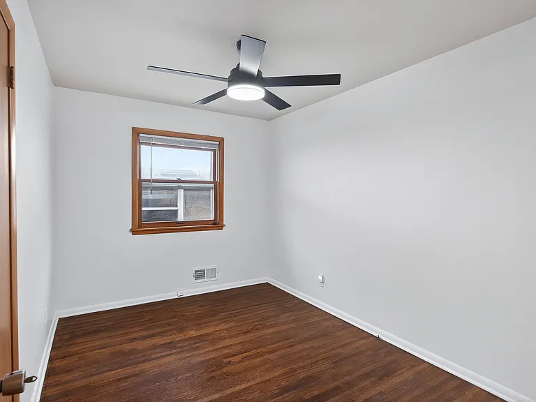 Second bedroom on the main level with a new ceiling fan!