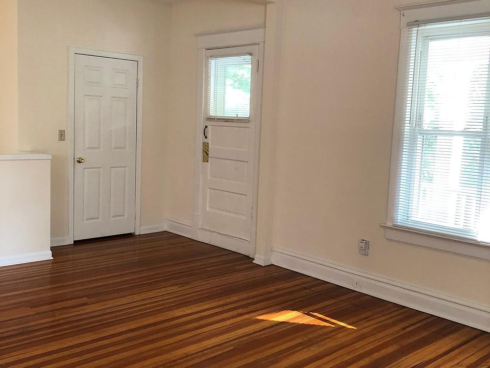 Living room closet door on the left. Door to the right of that leads out to the front balcony.
