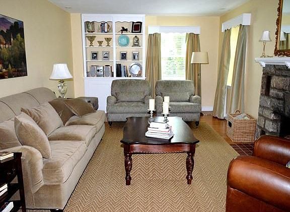 Lg living rm w/stone fireplace & built-in cabinets