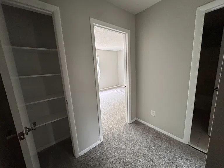 Upstairs hall looking to back bedroom and hall closet