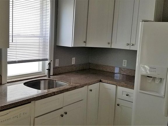Eat-in Kitchen - sunny with lots of windows and light, solid wood white cabinets, granite countertops, ceramic tiled floor, all appliances