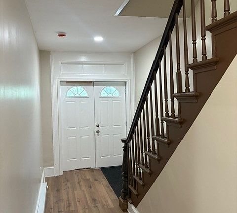 View from front door of apartment looking out into the shared hallway
