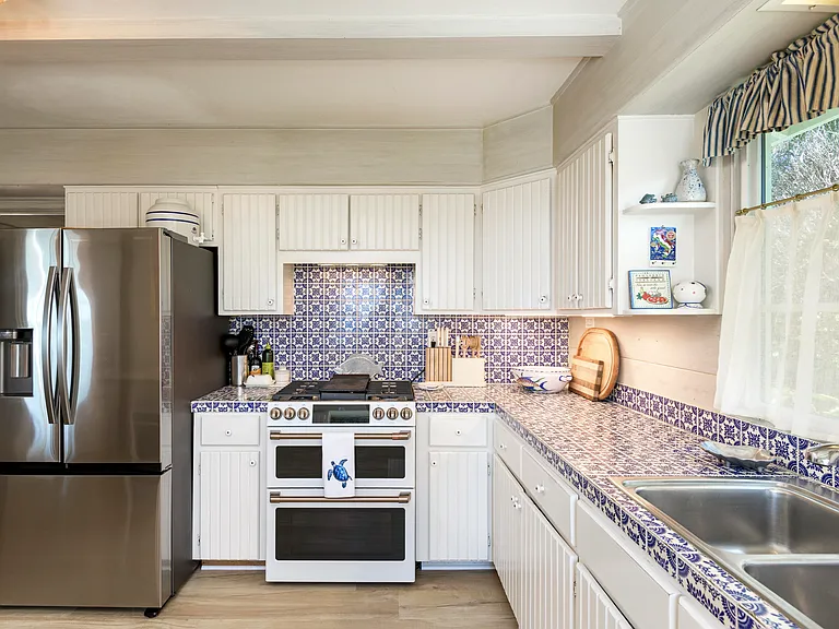 Kitchen with new refrigerator and new 6 burner gas range/ oven